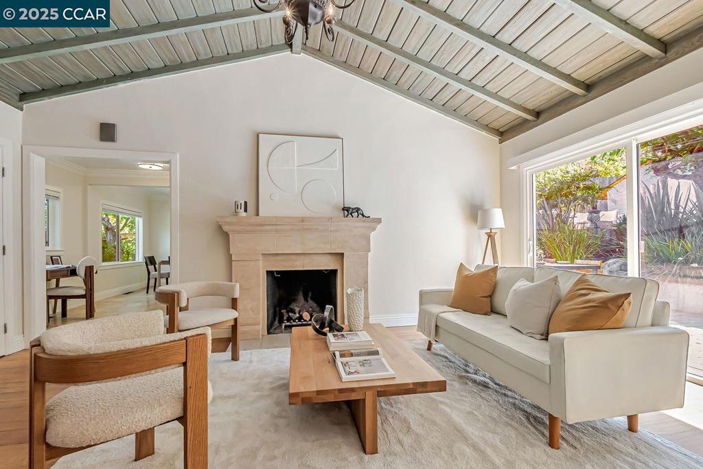 In the heart of Orinda, a private gated oasis awaits you. This charming single-level mid-century home is thoughtfully upgraded with stylish hardwood and travertine tile floors throughout. The living room features high ceilings and a wood-burning fireplace. The two spacious primary bedroom suites each have full bathrooms with marble counters. A contemporary kitchen overlooks tranquil gardens in the expansive back yard. Outside, enjoy a cup of coffee on the front patio or entertain guests in the fully landscaped back yard surrounded by tropical plants and trees. An automated irrigation system in front and back makes it easy to maintain your dream home. Additional features include a large detached shed in the back yard that can be used for a study, playroom, or storage. Also, Electric Vehicle charging is pre-wired in the carport. Close to downtown, freeways, BART, and top-rated schools, this location is ideal. Venture to Orinda community park, Safeway, the library, and the many shops and cafes. Don't miss this move-in ready gem!