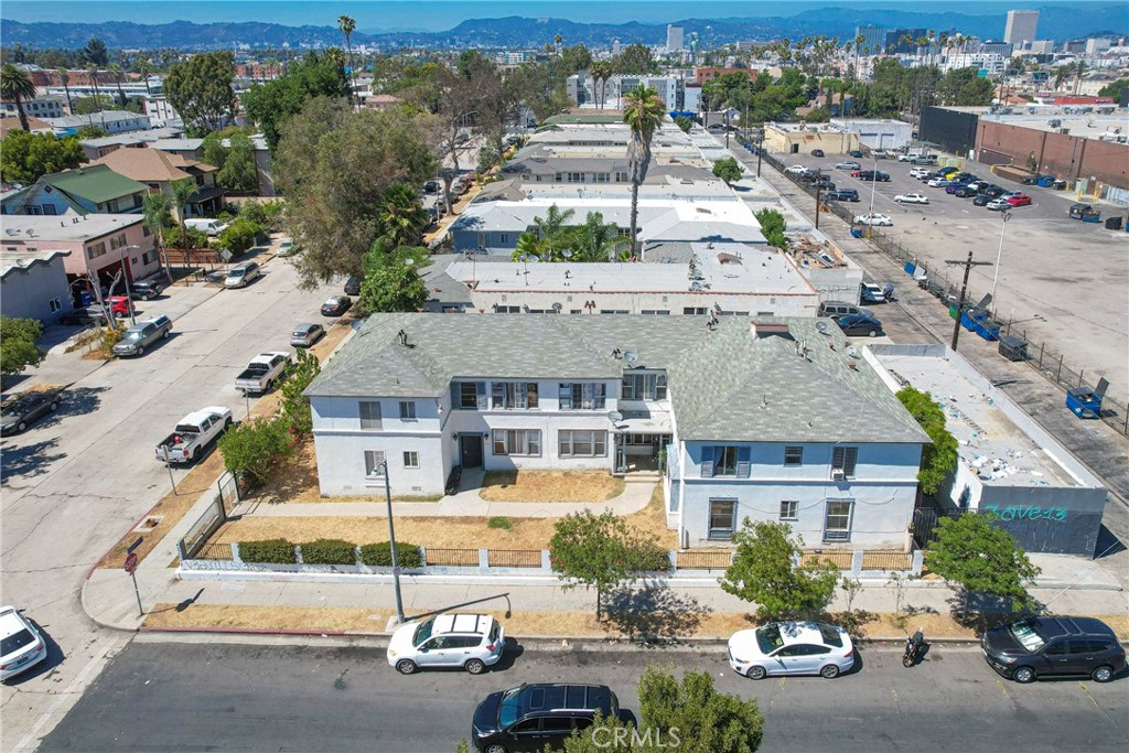 Presenting this 9-Unit Multifamily Opportunity in Prime Mid-City Los Angeles, a rare investment opportunity located at the high-visibility corner of St. Andrews Place and 18th Street in the heart of Mid-City Los Angeles — one of the city's most sought-after rental submarkets. This two-story, gated apartment building consists of 9 units with a favorable mix of studio, one-bedroom, and two-bedroom layouts, totaling approximately 7,562 square feet of rentable space on an 8,917 square foot corner lot. The property includes garage parking in the rear, with extra parking spaces for rent for tenants. Tenants are responsible for their own electric and gas utilities, offering investors lower operating costs. The asset benefits from close proximity to major freeway access points, retail corridors, public transit, and employment hubs, enhancing both tenant retention and future rental upside. Whether you're looking to stabilize for cash flow or reposition for long-term growth, this Mid-City asset checks all the boxes for savvy multifamily investors.