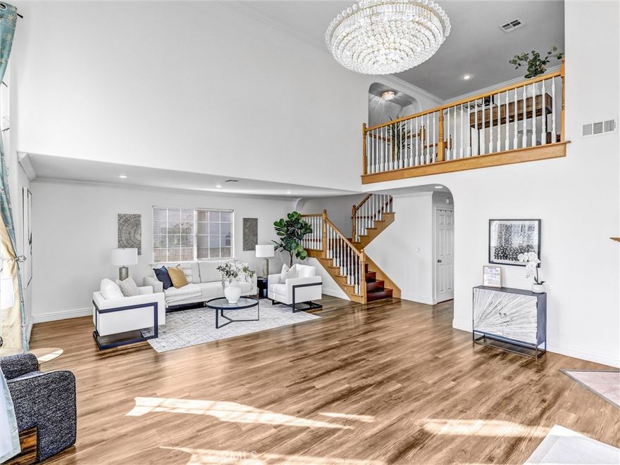 Built in 2013, this beautifully maintained detached PUD offers 4 bedrooms, 4 bathrooms and PAID OFF SOLAR PANELS, plus an office that can easily serve as a 5th bedroom.

The modern kitchen features sleek cabinetry, generous counter space, and quality newer appliances. The bright, high-ceiling living room is highlighted by a striking custom 38-bulb LED chandelier with multiple color settings, creating an inviting atmosphere.

On the first floor, you’ll find two spacious bedrooms, including a junior suite, along with a versatile office conveniently located next to a full hallway bath—ideal for guests or multi-generational living. Upstairs, a large loft provides a cozy relaxation area, accompanied by two additional suites, including the primary suite. Additional highlights include a 3-car garage, 4 private parking spaces, and dual tankless water heaters and A/C units and Gabrielino High School! This large PUD WITH NO HOA combining modern comfort, efficiency, and an unbeatable location is truly a rare find!