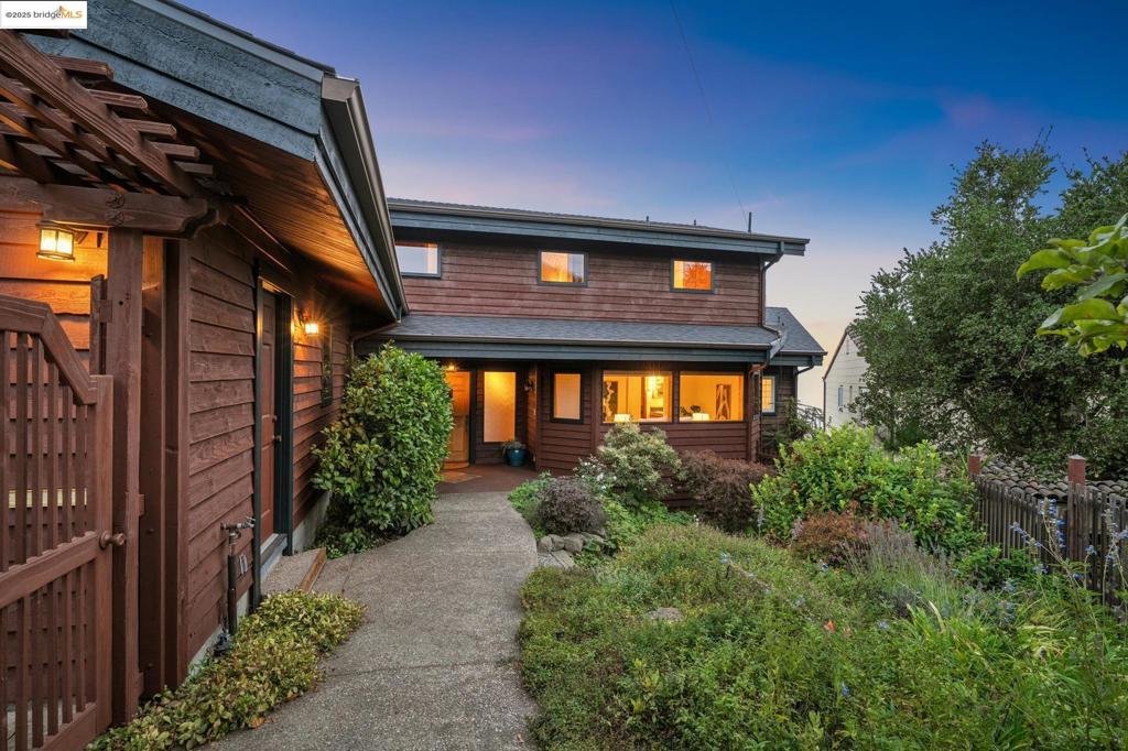 1534 Campus Drive, in the verdant Berkeley Hills, blends elegance and comfort in a captivating 2,710 sq. ft. single-family home with 4 bedrooms and 3 bathrooms. The highlight is its sweeping water and city views—two iconic bridges, dazzling sunsets, and fog drifting over the Bay—each day a new masterpiece. Designed for both intimate dinners and grand entertaining, the kitchen, dining, and living areas flow seamlessly, creating warmth and expansiveness. The home also offers abundant storage, a large laundry room with washer and dryer, a charming garden, and private outdoor space. Conveniences include a ceiling fan, fireplace, forced air, generator, air conditioning, and a large garage. With goats arriving annually to graze the hillside and university-owned land preserving the view in front, this home pairs practicality with beauty for a lifestyle as dynamic as its setting.