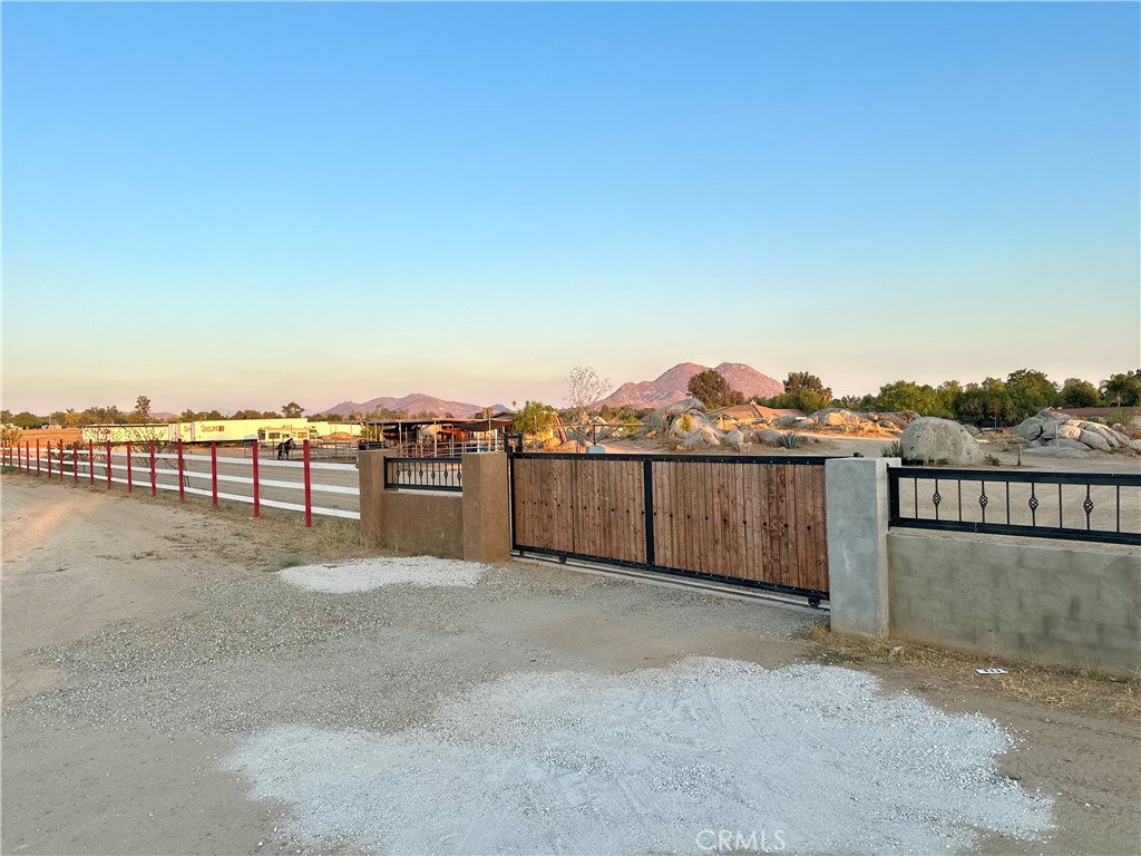 4.95 acres – flat, fully fenced, and full of potential
Tucked away at the end of a quiet cul-de-sac, this expansive 4.95-acre parcel offers the perfect blend of privacy, usability, and opportunity. With its generous rectangular shape and completely level terrain, the property is a blank canvas ready to bring your vision to life. The property is fully fenced for security and features its own water well for added self-sufficiency. Young trees have been thoughtfully planted along the perimeter, promising future shade, privacy, and natural beauty as they mature. Current horses, stables/corrals, trailers, and other temporary structures will be removed prior to closing, ensuring you receive a clean, open lot ready for immediate development. Buyers are encouraged to verify zoning, permitted uses, and any future plans with the appropriate agencies to ensure the property meets their intended needs.