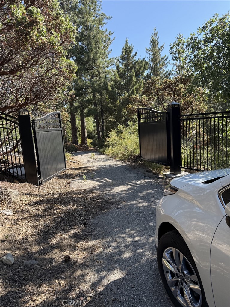 This stunning FLATTEST Property, located in Angelus Oaks, CA, offers a unique opportunity as it is A Fully Prepped and Turn-Key “BUG-OUT” Forest Land! Located only 60 minutes from Los Angeles and Palm Springs, It Is Truly A World AWAY! SIX ACRES of Forest Land - originally named Shangri-La What is the Best Aspect of this Land?? It would have to be the PRIVACY AND SECLUSION! All Boundaries Are Free Of ANY Neighbors On ANY AND EVERY SIDE! On top is Hwy 38. To the right is All National Forest. To the Left is a Steep Incline with the nearest neighbor approximately one mile away… maybe. The Land is Prepped with a DC Solar Trailer And Inverter, Which Can Power A Normal Sized House…ABSOLUTELY AMAZING! This Solar Trailer Can Power An Entire Home. You will Always Have Power – even when all the other power is shut down. This solar trailer has TWO 50 Watt Plugs and Three Massive Batteries! Additionally, the Land has a 250 Gallon Propane Tank. Also Included… Fifteen-Thousand Gallons of Fresh Water, in the form of Two Fresh Water Tanks. One is 9,000 Gallons and the second one is 5,500 Gallons. Graded Roads and Five Flat Pads where RVs can easily be placed and arranged. Also, the land has been scouted for an independent water well, where Well Drillers assure that water will Well Water for the land. The City of Angelus Oaks has Approved A Direct Connection to its water supply – for One Single Residence Family Unit. If you have been looking for a Get-Away Spot for you and your loved ones, when times turn crazy—This Is It! The Seclusion and Serenity Are - Phenomenal. There is Nothing, Anywhere, Nearby, That Compares To This … This Close To The City! This Ponderosa Ranch Of Yours Will Be The Envy Of All Your Friends And Family. In the Summertime, it is a place of Cool Respite and Retreat from the stifling heat of the City. In the Winter – well, you will have your own private Snow-Play Area that All of your friends will want to join in on the fun with you! When THE EMERGENCY HITS Hit THE FAN, Head To Shangri-La! You And Your Family Are SAFE with your Off-Grid Living Set Up at Shangri-La! Turn-Key and Ready To Go – You Owe It To Your Family and Everything That You Have Worked For… SHANGRI-LA AWAITS. Surrounded by towering trees and breathtaking mountain views, this is Truly a nature lover's paradise. ELEVEN LOTS Parceled Out- ZONING EVEN ALLOWED FOR A CHURCH TO BE PLACED ON IT! The Possibilities Are Endless On This Expansive Lot!