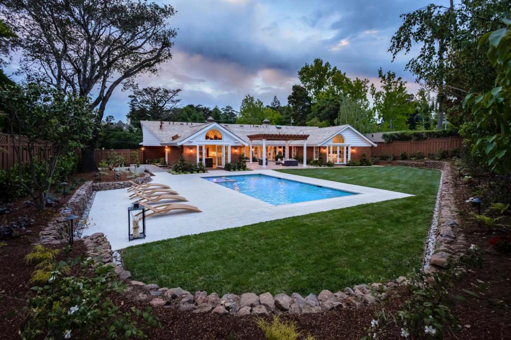 Newly completed modern interpretation of the classic New England Style blends in seamlessly to this premier lower Hillsborough neighborhood. Employing energy-efficient design principles, the sleek open concept floor plan begins with a dramatic great room that opens to a heated rear terrace, perfect for indoor/outdoor living. Striking finishes throughout are masterfully modern and functionally beautiful, while white oak floors tie every room together in quiet harmony. There are 5 bedrooms, each with en suite bath, plus 2 half-baths, and an office. The grounds are equally impressive with a pool and spa, landscaped gardens, and even restored historic gates at the front corner. This one-of-a-kind residence is also minutes to shopping and dining in downtown Burlingame and has access to excellent Hillsborough schools.