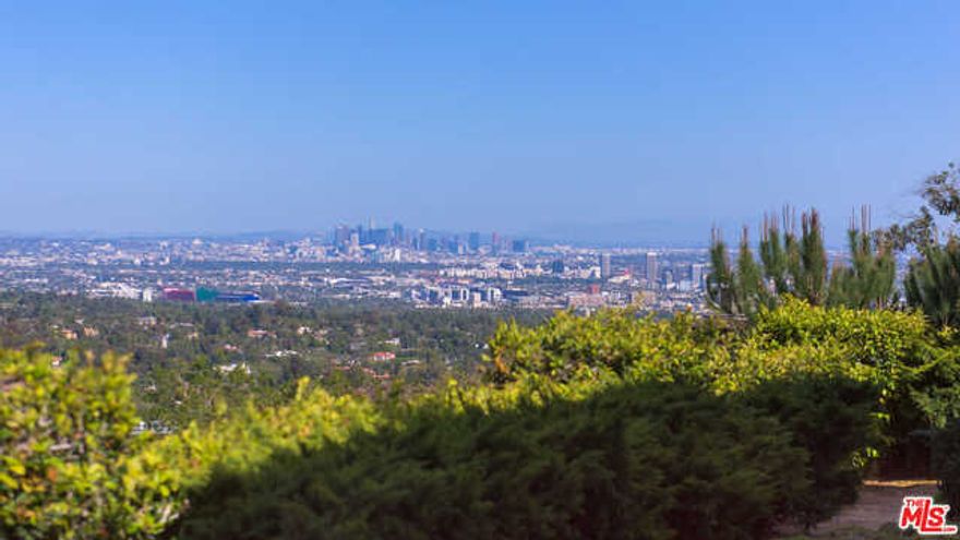 979. Bel Air's newest development opportunity. Through the internationally renowned and prestigious Bel Air gates, and located on a prime stretch of Bel Air Road, this grand estate site is surrounded by some of the most significant trophy properties in the area. Approx one acre flat, gated and private with city views, this property is offered fully-permitted with RTI plans and ready to build a palatial Richard Landry-designed French manor that can be finished either traditional or more contemporary. The approximately 24,000-square-foot estate which includes 4,000 sf of sub parking for 7 cars, will feature a dramatic gated motor court entry, two luxurious levels of impeccably designed living space plus a spectacular lower level with theater, fitness center, recreation lounge, spa and salon. This offering presents an opportunity to build a world class trophy estate with both land and views or there is also the option to fully renovate and reimagine the existing 11,600 SF property.