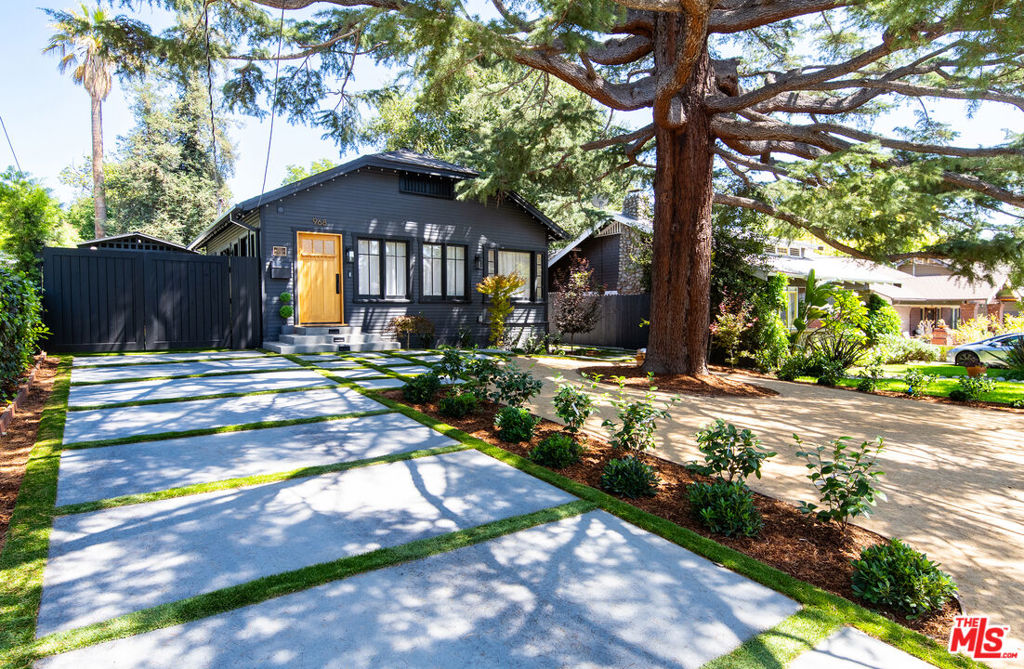 Experience a rare blend of timeless architecture and modern luxury at 968 Palm Terrace, a fully restored and expanded historic residence in Pasadena's highly coveted Washington Square Historic District. Offering 2,301 square feet of living space, this exquisite property includes a brand-new 381 SF ADU, a completely reimagined main residence with 3 bedrooms and 3 bathrooms, and a seamless indoor-outdoor flow that embodies California living. The home benefits from the Mills Act Program, providing significant property tax savings, while offering a one-of-a-kind lifestyle framed by tree-lined streets of palm trees and cherry blossoms. Inside, the design unites traditional craftsmanship with contemporary sophistication. The 1188 SF newly built addition complements the restored original 732 SF home, creating a 1920 SF Main House with an open floor plan with soaring 13+ ft cathedral ceilings in the living, dining, kitchen, and family rooms. Natural light pours through skylights and Marvin windows, while a Fleetwood 90 corner pocket door dissolves the boundary between indoor comfort and outdoor serenity.The chef's kitchen showcases high-end Thermador appliances, a white oak island, and a stunning custom Marmorino Venetian plaster range hood. The primary suite is a private retreat, featuring a Marmorino accent wall, a spa-inspired marble bathroom with steam shower, soaking tub, dual shower heads, and a custom white oak dual vanity. Additional en-suite bedrooms include thoughtfully designed baths, one with a custom waterproof plaster finish and wood accents for a zen-like spa ambiance.Every detail reflects luxury and innovation, including smart home integration: smart thermostat, smart switches, irrigation, appliances, water monitoring and leak detection system, ozone pool app, and Google camera system.Step outside to a new pool and infinity spa with ozone filtration, surrounded by lush hedges for complete privacy. Landscaped grounds feature roses, camellias, boxwood, a Japanese cherry blossom, a cedar deodar and multiple Japanese maples. Enjoy panoramic mountain and treetop views from the 289 SF rooftop deck, framed by oaks, redwoods, jacarandas, and palms. The ADU offers private luxury living with custom Italian cabinetry, marble finishes, stacked washer/dryer, and a 3-panel folding door that opens directly to the pool. Perfect for guests, extended family, or rental income.With new roofs, insulation, copper plumbing, ABS sewer lines, HVAC, drainage, and a whole-house water purification and softening system, this residence is functionally brand new while honoring its historic charm.