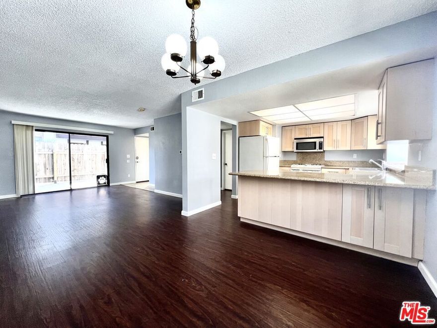 Welcome to 17057 S Vermont Avenue, Unit #117  a spacious and versatile 3-bedroom , 2.5-bath tri-level townhome in the heart of Gardena. This thoughtfully designed 1,264 sq. ft. home features a bright kitchen with granite countertops and ample cabinet storage, plus in-unit laundry with washer included. The oversized attached garage easily accommodates two cars with additional room for bikes, and even includes a separate storage area.The primary suite offers soaring ceilings, a large walk-in closet, and a private en-suite bath with a walk-in shower. Enjoy your own private front patio, or take advantage of community amenities including a sparkling pool and relaxing spa.Pet-friendly and dog-considerate, this home is ideally located near shops, dining, schools, and offers quick access to the 110 and 91 freewaysmaking commuting a breeze and putting the best of the South Bay and Greater LA within reach.
