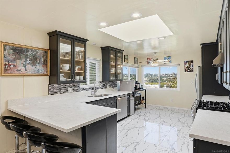 WELL MAINTAINED LA MESA HIGHLANDS HOME | PRIVATE ROAD ACCESS | PANORAMIC VIEWS | SECLUDED HILLSIDE LOT | NEW ROOF  Tucked away along a large hillside lot with private road access, this impressive La Mesa residence offers 2,488 sq. ft. of comfortable living space with exceptional flexibility ideal for multi-generational living, hosting guests, or income producing opportunities. The main level includes three bedrooms and two bathrooms along with inviting living and dining areas, while the lower level features a spacious family room plus an additional bedroom and bathroom. This secluded lot extends beyond your private road. Enjoy the breathtaking panoramic views of the neighborhood from all over your home.  The fully renovated kitchen exudes quality with its ample custom cabinetry and premium finishes, while the newer roof and dual-pane windows add comfort and efficiency. Meticulously cared for over the years, this home is ready to move in and make your own.  Convenient access to Helix High School, La Mesa Village, and local community events such as farmer's markets, car shows and Oktoberfest  With its combination of privacy, prime location, and solid craftsmanship, this La Mesa gem is an incredible opportunity for any potential buyer!