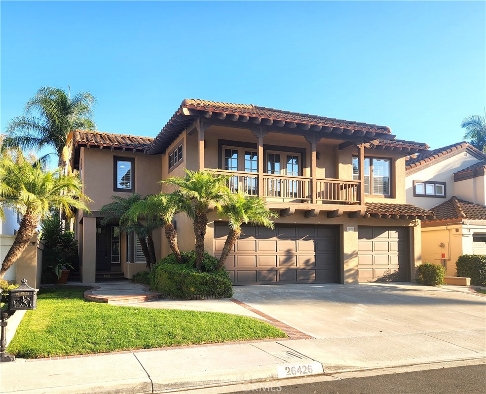 This highly sought-after residence boasts a bright and airy floor plan with 4 spacious bedrooms plus a large bonus room. The primary suite features a cozy fireplace and a beautifully updated bath complete with dual sinks, a separate tub and shower, and a generous walk-in closet. The Kitchen, the heart of the home showcases granite countertops and a large center island that seamlessly flows into the family room, with a cozy fireplace. The light and bright living and dining room with vaulted ceiling showcase an elegant wrought iron staircase. The convenience of a main floor bedroom with an adjacent full bath is a plus. An inside laundry room including a utility sink and storage cabinets. Additional features include, new ceiling fans with remotes, fresh paint, new hardware, new carpeting, Nest thermostat, and recessed lighting with dimmers. The spacious backyard features a patio cover and an open area for play or relaxation, offering privacy with no homes behind and delightful peek-a-boo views. The three-car garage offers ample storage and parking. Situated just one block from the award-winning Bathgate Elementary School. Conveniently located near, FWY's, Toll Road, Mall, shopping centers, Library, parks, sport fields, trails. Plus enjoy exclusive Lake Mission Viejo’s amenities, such as boating, swimming, summer concerts and so much more, gardener included.