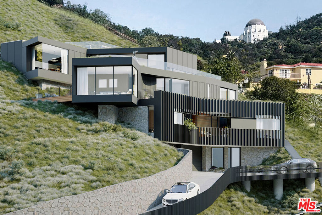 Perched above Los Feliz Boulevard, this vacant 2.637-acre lot offers a rare opportunity to build in one of LA's most sought-after neighborhoods. Surrounded by mature trees and sweeping views, the hillside site combines a sense of privacy with proximity to Griffith Park, the Greek Theatre, and the shops and restaurants of Hillhurst and Vermont. A prime setting for a future residence or retreat in an incredible location. The lot is vacant; renderings by StudioIvanov are for reference only.