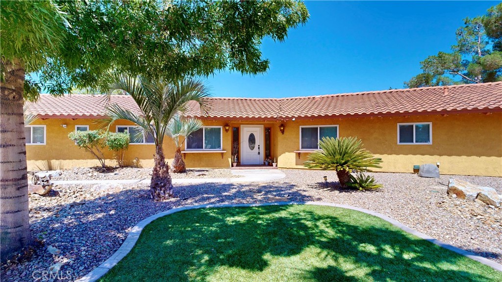 Welcome to Your Dream Home! This stunning one-story residence boasts of 4 bedrooms and 2.5 bathrooms, offering a generous 2,650 square feet of living space on a 1.3-acre property to store all your toys, build a pool, grow a family, and create your oasis. It has "40 PAID OFF SOLAR PANELS" to help alleviate financial stress. This home exudes charm. Step inside to discover a well-designed layout featuring tile flooring, Ceiling fans in each room, and a Fireplace for a homey feel. Whether you're hosting a summer barbecue or simply enjoying a quiet evening, this backyard is your personal retreat. Conveniently located with easy access to shopping and schools, this home offers the perfect blend of comfort and practicality. It's truly a must-see to appreciate all the features and potential it has to offer. Don't miss out on the opportunity to make this beautiful house your new home. Schedule a viewing today and experience the magic for yourself! (Check out the 360 walkthrough.)