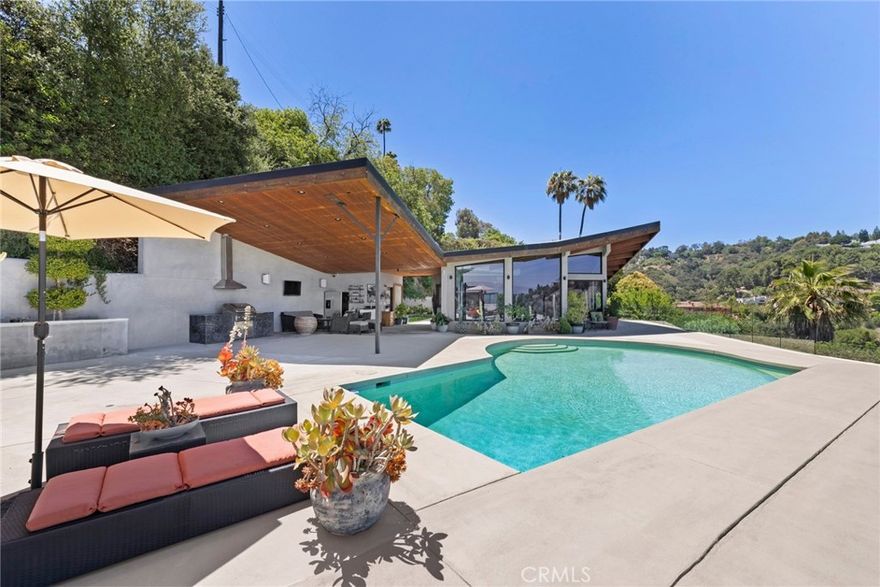 Nestled in the serene Sherman Oaks hills, this single story three bedroom Mid-Century Modern retreat offers breathtaking panoramic views of the mountains, valley, and sparkling city lights. Designed for privacy and seclusion, the home features an expansive living room with soaring ceilings, a fireplace, and walls of glass that frame the stunning vistas, an ideal setting for both everyday living and memorable entertaining. Enjoy seamless indoor outdoor living in this tranquil hideaway, located just minutes from major studios and with convenient access to the Westside. A rare opportunity to lease a stylish Mid-Century gem in a prime hillside setting. Fully furnished. 14 Month minimum lease.