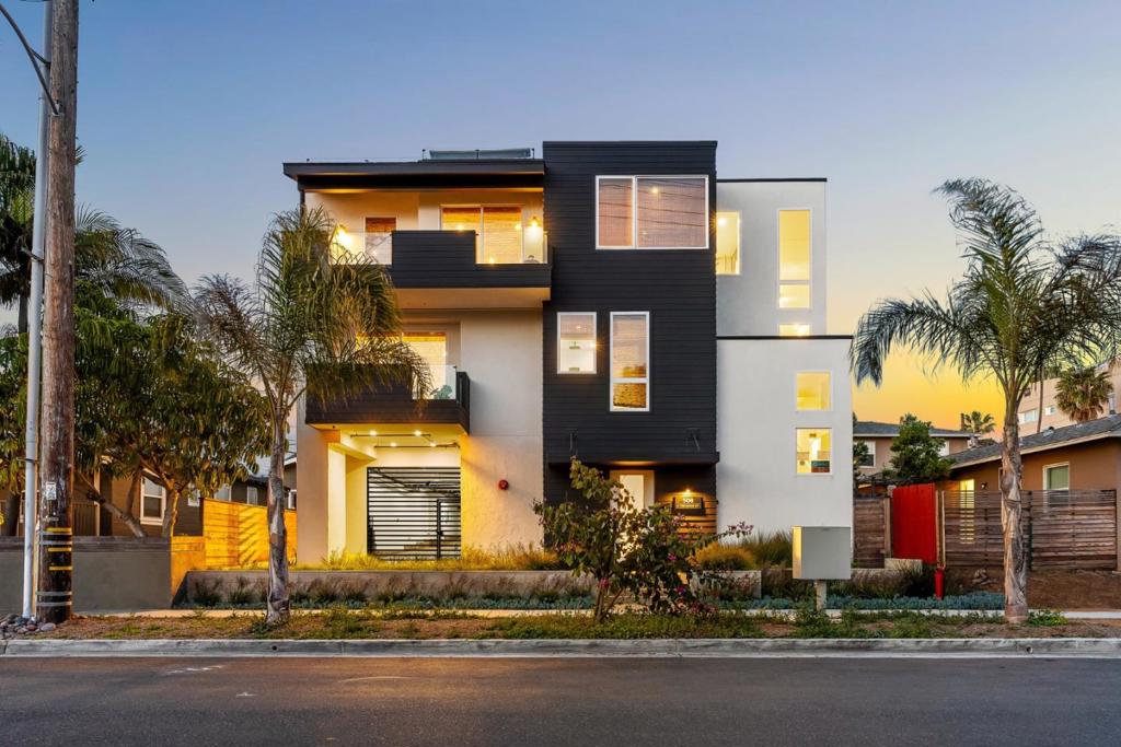 Welcome to 508 N Tremont St Unit your modern coastal escape in the heart of Oceanside. Built in 2023 (Like NEW), this 3-bed, 3.5-bath luxury townhome offers 2,181 sq ft of beautifully designed living space just six blocks from the beach. The open-concept layout features premium finishes, vaulted ceilings, hardwood and tile flooring, and an abundance of natural light. The chef's kitchen is equipped with a gas range, double oven, built-in microwave, and more. Primarily two-story living, with a junior suite for guests or multi-gen flexibility, plus guest and primary all on second level. Entertain from your private rooftop lounge with ocean views, hot tub, outdoor shower, firepit, and full outdoor kitchen. Additional highlights include central A/C, a dedicated laundry room, a 2-car garage, and the option to install a private elevator. Minutes from Oceanside Pier, the Marina, Regal Cinemas, and top dining and resorts. Ideal as a full-time residence, vacation retreat, or investment. Floor plan and additional photos available by 8/8/2025. Offer deadline: 8/14/2025. FAQ available upon request. Private Showings Available after first weekend of open houses.
