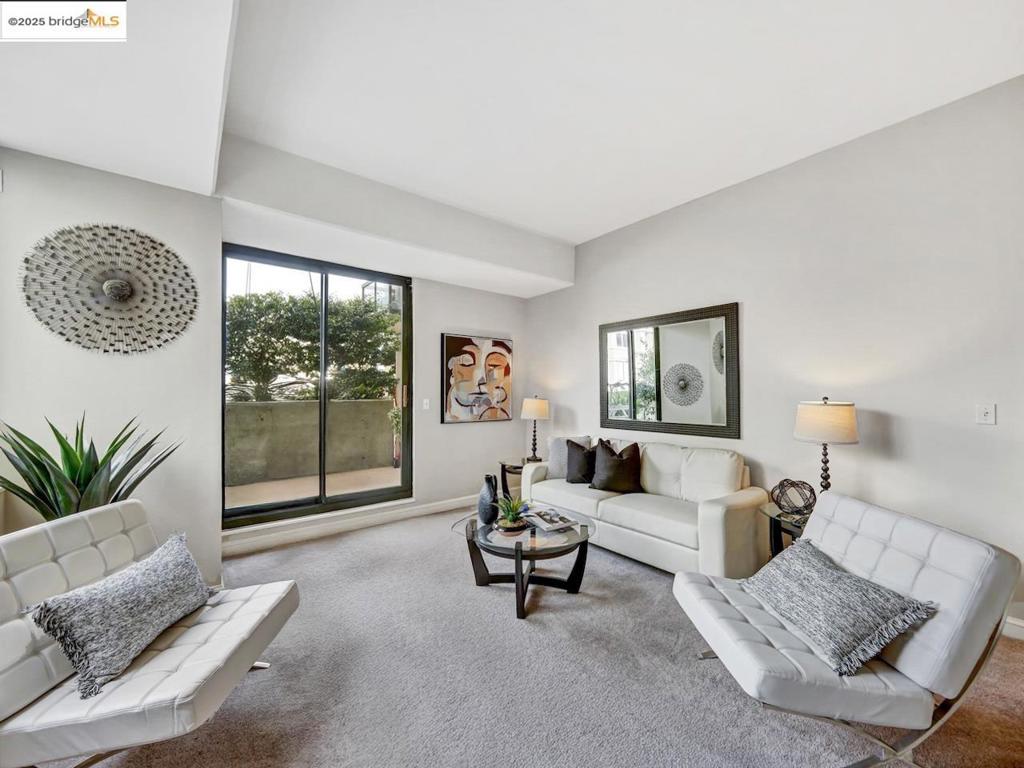 Welcome to 1 Daniel Burnham Court, Unit 101 – a bright and inviting 1-bedroom, 1-bathroom condo offering a perfect blend of comfort, security, and location in the heart of San Francisco. Thoughtfully designed with an open floor plan, the home features a sunlit living and dining area that opens to a large private balcony, perfect for relaxing or entertaining. One of only four in the building. The kitchen offers generous cabinetry and flows seamlessly into the living space via the hallway and the dining room, while the spacious bedroom includes ample closet space and large window. A clean bathroom and hallway storage complete the home’s efficient layout. Residents enjoy access to secure garage parking (1 space included), located conveniently close to the elevator, and the peace of mind of a 24-hour doorman in a full-service, elevator building. Just steps from dining, shopping, medical centers, public transit, and major commuter routes, this home is ideal for first-time buyers, city professionals, and investors alike.