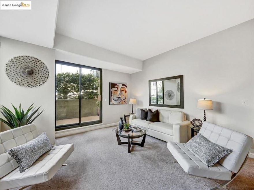 Welcome to 1 Daniel Burnham Court, Unit 101 – a bright and inviting 1-bedroom, 1-bathroom condo offering a perfect blend of comfort, security, and location in the heart of San Francisco.  Thoughtfully designed with an open floor plan, the home features a sunlit living and dining area that opens to a large private balcony, perfect for relaxing or entertaining. One of only four in the building. The kitchen offers generous cabinetry and flows seamlessly into the living space via the hallway and the dining room, while the spacious bedroom includes ample closet space and large window. A clean bathroom and hallway storage complete the home’s efficient layout.  Residents enjoy access to secure garage parking (1 space included), located conveniently close to the elevator, and the peace of mind of a 24-hour doorman in a full-service, elevator building.  Just steps from dining, shopping, medical centers, public transit, and major commuter routes, this home is ideal for first-time buyers, city professionals, and investors alike.