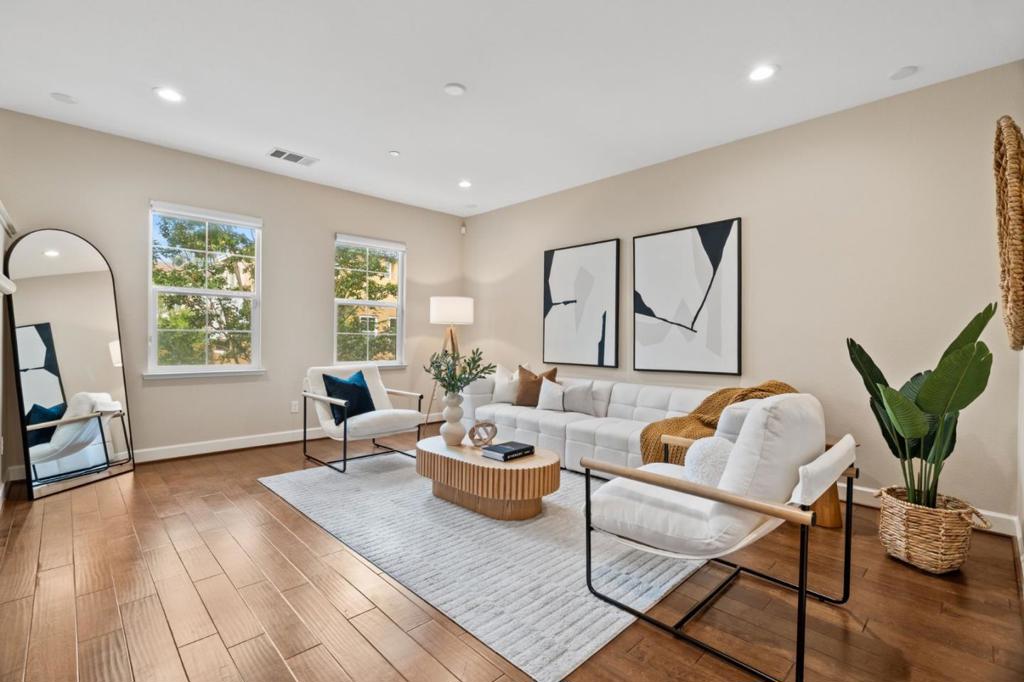 Comprehensively remodeled, this spacious move-in ready townhouse is peacefully nestled beside a scenic park and playground in one of Santa Clara's most desirable communities, just a short drive from the South Bay's largest employers and finest amenities. Smartly updated throughout, the intuitive floor plan ensures comfort and versatility for those craving private office space thanks to three full ensuites, including a ground-floor junior suite and dual upstairs ensuites, showcasing a luxurious master suite with dual sink vanity, separate toilet room, walk-in shower, and french door walk-in closet with built-in storage. The expansive open concept living area with hand-scraped engineered wood flooring is bathed with natural light through panoramic windows and features a spacious updated kitchen with granite countertops & stainless appliances, in-ceiling LED lighting, a utility room with washer and dryer, & a bonus office area. Benefiting from cheap Santa Clara utilities and with too many upgrades to catalog, including newly installed hardwood flooring upstairs, tri-zone central heat and air conditioning, and a fresh professional paint job, this spacious home has been put through an 18-point inspection regimen and is also identified as *Certified Pre-Owned* with a home warranty.