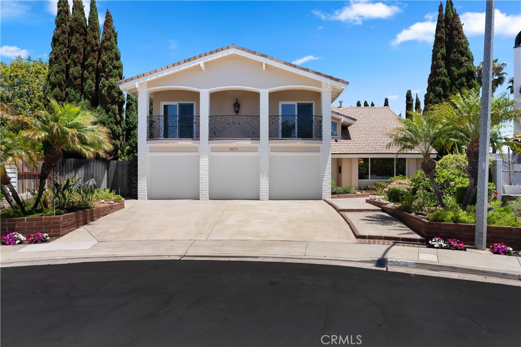 Tucked away at the end of an exclusive cul-de-sac, this beautifully remodeled and expanded home sits on a rare, very private 12,300 sq ft lot and offers the ultimate in luxury and outdoor living. The resort-style backyard features a sparkling pool and spa, expansive side yards perfect for recreation or additional entertaining, and an extended sunroom—a stunning full glass-enclosed space with five sliders, skylights and panoramic views of the backyard oasis.
Inside, the open-concept kitchen is a true showstopper, boasting high-end custom cabinetry, a copper farmhouse sink, built-in refrigerator, glass-front cabinets, and a generous center island with hardstone countertops. Every bathroom in the home has been thoughtfully remodeled with custom tile work and furniture-inspired vanities that add character and charm. The luxurious master suite includes a spa-like bath with a freestanding soaking tub, a cozy fireplace, walk-in shower with marble accents and custom tile surround, skylight, custom beveled glass window with marble casement, dual custom vanities with heated floors vents, and built-in power outlets inside the drawers. A large walk-in closet completes the suite.
Additional highlights include: a converted bonus room offering two extra bedrooms which includes balcony access with tile flooring and a custom railing. Spacious secondary bedrooms, plantation shutters, custom interior stair railing, wood-like flooring throughout, updated garage doors with large modern panels, a downstairs bedroom and full bath, an indoor laundry room with sink, new interior paint, extensive custom woodwork and A/C. All this is part of an ideal open floor plan, excellent for both entertaining and everyday comfort. This home is highly private and truly one-of-a-kind.