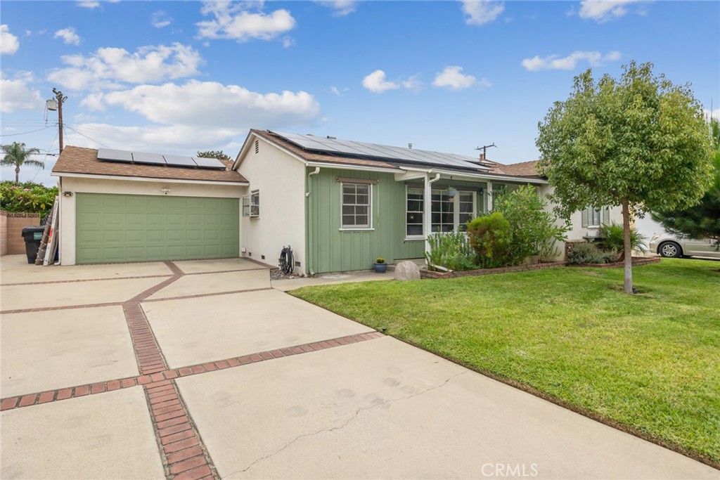 Welcome to 5020 N Bonnie Cove Ave, a beautifully updated single-story residence nestled in the highly desirable Charter Oak community of Covina. Built in 1954 and thoughtfully remodeled, 5020 N Bonnie Cove Avenue seamlessly blends timeless charm with modern upgrades, offering comfort, style and functionality for today’s lifestyle. Step inside 5020 N Bonnie Cove Avenue and you’re greeted by an inviting open layout featuring 3 spacious bedrooms, 2 well appointed bathrooms, and 1,478 square feet of comfortable living space. The heart of the home is the upgraded kitchen, showcasing quartz countertops, sleek tile backsplash, modern cabinetry, and newer appliances. The adjoining dining and living areas are bathed in natural light and enhanced by laminate flooring, creating a warm, welcoming environment perfect for gatherings or quiet nights in. Beyond aesthetics, 5020 N Bonnie Cove offers practical updates and long-term value: upgraded plumbing and electrical systems, solar panels for energy efficiency, central air conditioning, and a newer roof. Each detail has been carefully considered, giving buyers peace of mind and reduced maintenance costs.
The spacious 7,525 sq. ft. lot is a true highlight. Mature landscaping provides beauty and privacy, the possibility for RV parking, a covered patio, and a 2-car garage ensure flexibility for vehicles, hobbies, or entertaining. The backyard is ideal for barbecues, play, or relaxation under the shade of established trees. Located in an established neighborhood, 5020 N Bonnie Cove offers easy access to schools, shopping, restaurants, and major freeways—making commuting and daily errands a breeze. This home represents an incredible opportunity to own a move-in ready property in a centrally located community, combining lifestyle, convenience, and value. Don’t miss the chance to make 5020 N Bonnie Cove Ave your next home. I invite you to come and see all that 5020 N. Bonnie Cove has to offer you!