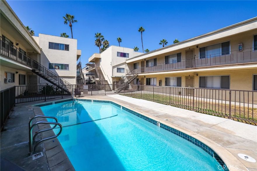 Welcome to your charming new home in Long Beach! This 2-bedroom, 1.5-bathroom apartment is nestled within a secure, gated community that offers a host of amenities. Enjoy the California sun by the community pool or take your furry friend for a stroll in our pet-friendly environment. The apartment itself has been freshly painted, giving it a clean and modern feel. The bedrooms are carpeted with new, plush material, while the rest of the apartment boasts new LVP flooring, adding a touch of elegance to the space. The kitchen comes equipped with a gas stove, perfect for those who love to cook. Additionally, the convenience of a community laundry facility eliminates the hassle of laundromat trips. Garage space available for an additional fee.  Located on the 2nd floor, experience the best of Long Beach living in this beautiful apartment.