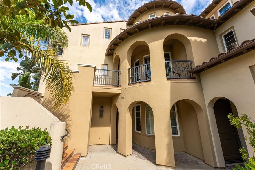 Experience true coastal luxury living in this exceptional residence offered for rent, located directly across the street from Huntington Beach and nestled behind the Hyatt and Hilton resort hotels in the prestigious gated community of The Waterfront, offering resort-style amenities including a pool, spa, cabana, and barbecues. The largest Sea Cove model, this 2,664 square foot home spans three sunlit levels of open-concept living with exquisite architectural detailing designed to impress—volume ceilings, arched passages, and elegant décor niches. Every space is thoughtfully appointed and serene, featuring two large primary suites, 2.5 baths, two staircases, a family room, a loft sitting area with views(optional third bedroom), an office with custom Cherrywood built-ins, an additional loft niche perfect for a library or second office, two balconies, and an upper-level laundry room with cabinetry and sink. The interior showcases fine craftsmanship throughout with dual-zone central A/C, hardwood flooring, sculptured carpet, crown molding, dual-pane windows, plantation shutters, French doors, recessed lighting, raised panel doors, and custom built-ins. A welcoming front balcony overlooks a lush greenbelt where you can enjoy morning coffee and ocean breezes, while inside a dramatic two-story foyer leads to the formal living room with fireplace. The gourmet kitchen boasts granite countertops, wrap-around breakfast bar, white shaker soft-close cabinetry, and premium stainless appliances, flowing seamlessly into the family room with custom built-in media center and French doors opening to a balcony with built-in barbecue. Entertain in style in the awe-inspiring rotunda formal dining room with coffered ceiling and adjacent wine grotto with floor-to-ceiling wine storage and built-in cooler. The luxurious primary suite is a private retreat with walk-in closet and spa-inspired bath with dual vanities, soaking tub, and separate shower. Completing this home is a second staircase leading to the finished garage with epoxy flooring and storage. More than a residence, this is a rare opportunity to experience the very best of Orange County coastal living in an unmatched resort setting.