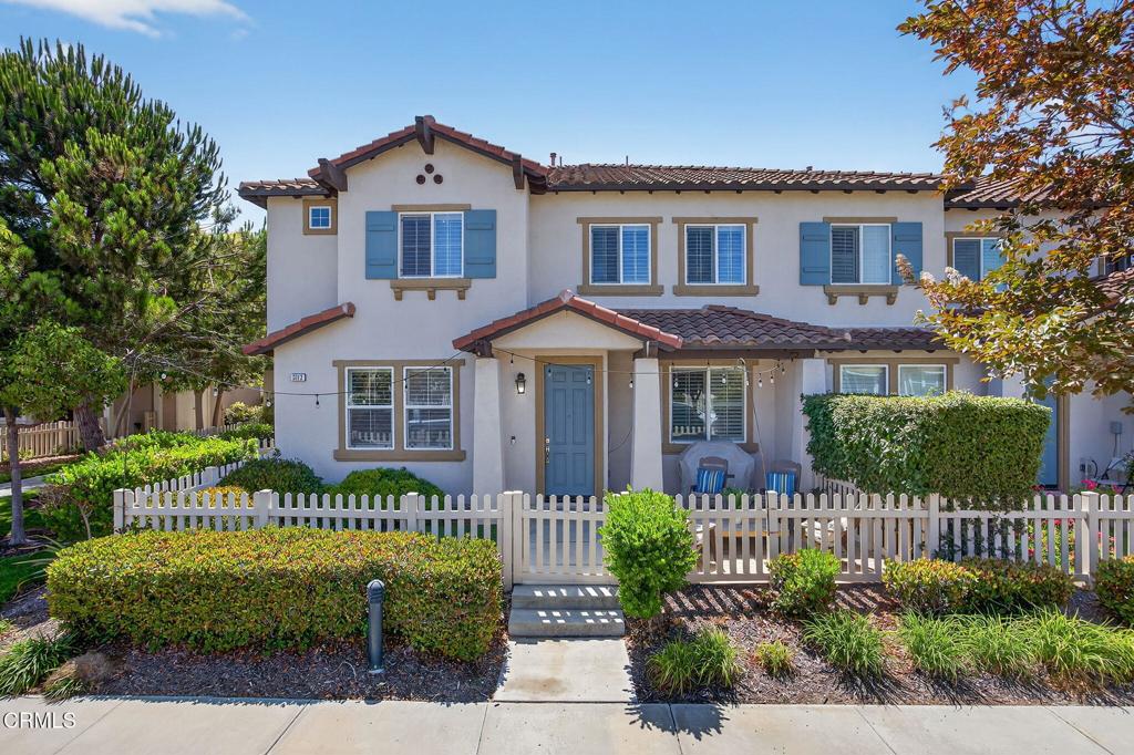 Welcome to this end-unit two-story townhome in the Collage community of Riverpark! With 3 upstairs bedrooms, 2 upstairs bathrooms and a downstairs powder room, this beautifully-maintained home has many special features. These include: air conditioning, a full-size driveway, an attached 2-car garage with direct-access to the kitchen, and a front entry courtyard with turf, landscaping and a paver patio with room for grilling and entertaining. Step into the inviting open-concept main floor layout, where the living room, dining area, and kitchen flow as a true great room. The spacious kitchen features a center island, generous cabinet storage, a corner pantry, ample counter space, and a breakfast bar that opens to the dining area. Enjoy the convenience of the upstairs laundry room with a utility counter, and the decorator-inspired details including crown moulding, custom colors, window treatments, wood floors, and carpet in the bedrooms. Retreat to a primary suite with mountain views, a spacious closet and a dual-sink vanity. There is a nearby greenbelt, and the community offers multiple parks, playgrounds, sports courts and fields, scenic fountains and gazebos, a dog park, and an off-street pathway for enjoying the outdoors --plus easy access to the 101. All of this is less than a mile to The Collection's dining, shopping, fitness, and entertainment. Riverpark also offers several public schools serving students through 8th grade, including a STEAM school. Whether enjoying the quality of life offered in RiverPark or as a gateway to other communities in Ventura County, this location is hard to surpass for its convenience and accessibility.