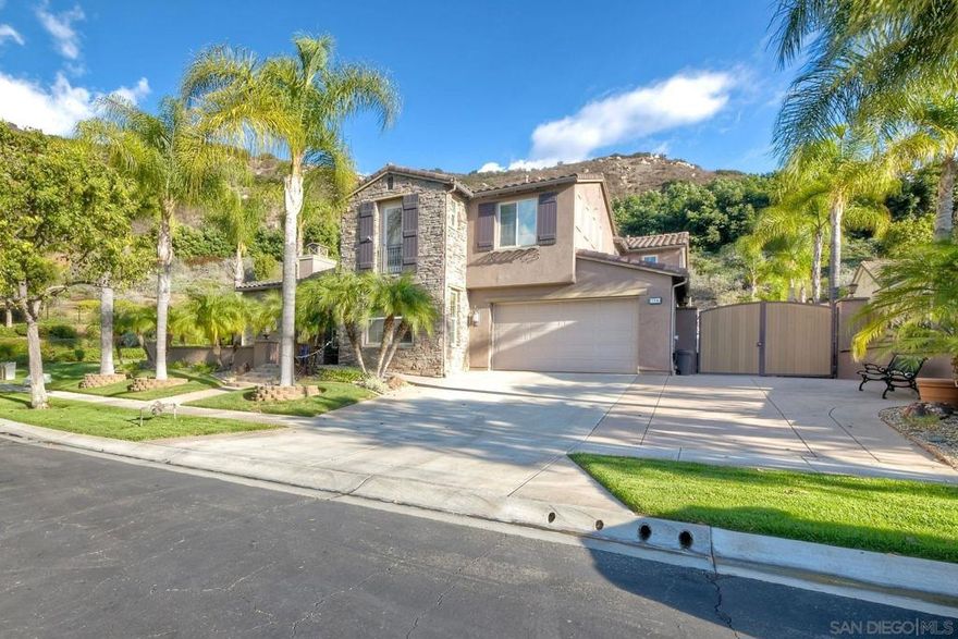Welcome to your own entertainers paradise in the gated community of Rancho Vistamonte. This property exudes quality that you will feel immediately when you walk in the door. This spacious 4-bedroom, 3.5-bath home boasts nearly 4,000 sq ft of gorgeous living space featuring a main-level Bedroom as well as an additional BONUS (office) room on the same floor, HIGH ceilings, abundant natural light, SOLAR (owned) and brand new carpet (new carpet not in photos). The family room with fireplace seamlessly flows to the dining space and backyard. The second floor consists of 3 bedrooms, including the PRIMARY suite with additional sitting area, his & her closets. Throughout the home are graceful archways for added architectural charm. Plenty of room on the side of the house for RV, Boat, or other toys. The backyard is a private retreat designed to impress with a refreshing pool and spa. This is a great backyard for entertaining. Located within the San Pasqual Union School District, this move-in-ready home checks all the boxes for luxury, comfort, and function.
