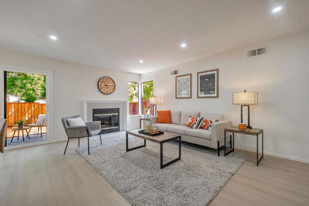 Perfect Starter or Downsize Home with a Spacious Private Backyard! OPEN HOUSE SATURDAY (7/26) & SUNDAY (7/27) 1-5 PM Welcome to this bright and modern ground-floor 2-bed, 2-bath corner condo, ideally located in a family-friendly Fremont neighborhood. This single-level home offers easy, stair-free living and boasts one of the largest private backyards in the community perfect for entertaining, gardening, or simply relaxing. Step inside to a fully remodeled interior featuring quartz kitchen counters, brand-new appliances, luxury vinyl plank flooring, recessed lighting, fresh paint, and beautifully updated bathrooms. The open-concept layout seamlessly connects the kitchen, dining, and living areas, highlighted by a large breakfast bar that is ideal for everyday living and entertaining. Both bedrooms feature spacious en-suite bathrooms, providing comfort and privacy. Enjoy the convenience of an attached 1-car garage with in-unit washer/dryer and no rear neighbors for extra peace and quiet. Low HOA covers water, trash, and pool access. All just minutes from BART, Lake Elizabeth, Mission Peak, shopping, dining, hospitals, and top-rated schools!