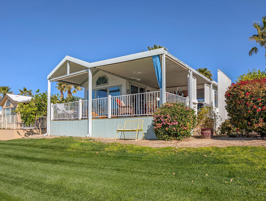 Situated high above the 9th hole on the golf course with views of Mt. San Jacinto, water features, and blue sky for miles this great 2000 Skyline Park Model awaits you! Here we have 1+ bedroom, 1 bath and many upgrades including new flooring, new carpet on back deck, king sized bedroom, 2nd sleeping area in California room equipped with a beautiful queen size murphy bed and the room has a door that closes off to main home for added privacy for guests. This well-appointed home is south facing and offers the most spectacular scenery from all around this unique place, here you can have a private and serene setting on the large, covered deck perfect for entertainment and on the inside of the home we have, a bright cheery decor and natural sunlight throughout make this an ideal getaway or permanent place to call home. Caliente Springs is a premier 55+ luxury resort with amenities that make you feel like a VIP, including a mineral-fed hot spring pool and spas, a 9-hole golf course, water ball, water aerobics classes, yoga, 8 pickleball courts, tennis courts, and much more in this lively and active community. The lot is not owned; space rent is $950. Comes with golf cart.