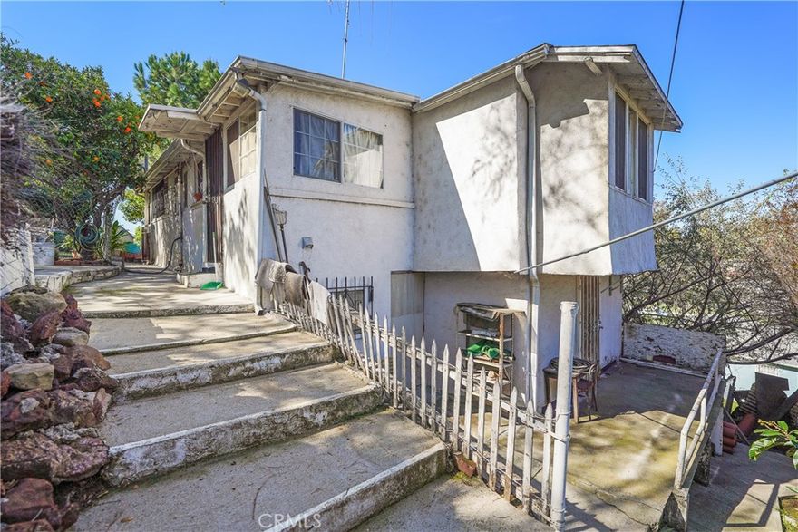 Investor, developer, or contractor? This is your Echo Park opportunity. Set on a generous 50x150 ft lot, 2149 Fargo St is a 2-bedroom, 1-bath fixer or teardown with serious upside for those looking to remodel, expand, or build new. The existing 1,086 SF home (per assessor) includes a raised foundation with a lower-level recreation room and a workshop area with plumbing access, plus a detached 396 SF structure (built in 1938) perfect for an office, studio, or future ADU. A second parcel (APN: 5422-021-005) provides an irrevocable easement and right of way, increasing development flexibility and long-term value. There's also a leveled parking pad offering rare additional off-street parking. Zoned for creativity and positioned minutes from Elysian Park, Sunset Blvd, Dodger Stadium, and DTLA, this land-value listing is priced for action and primed for transformation. Whether you’re flipping, building, or holding, the potential here is undeniable.
