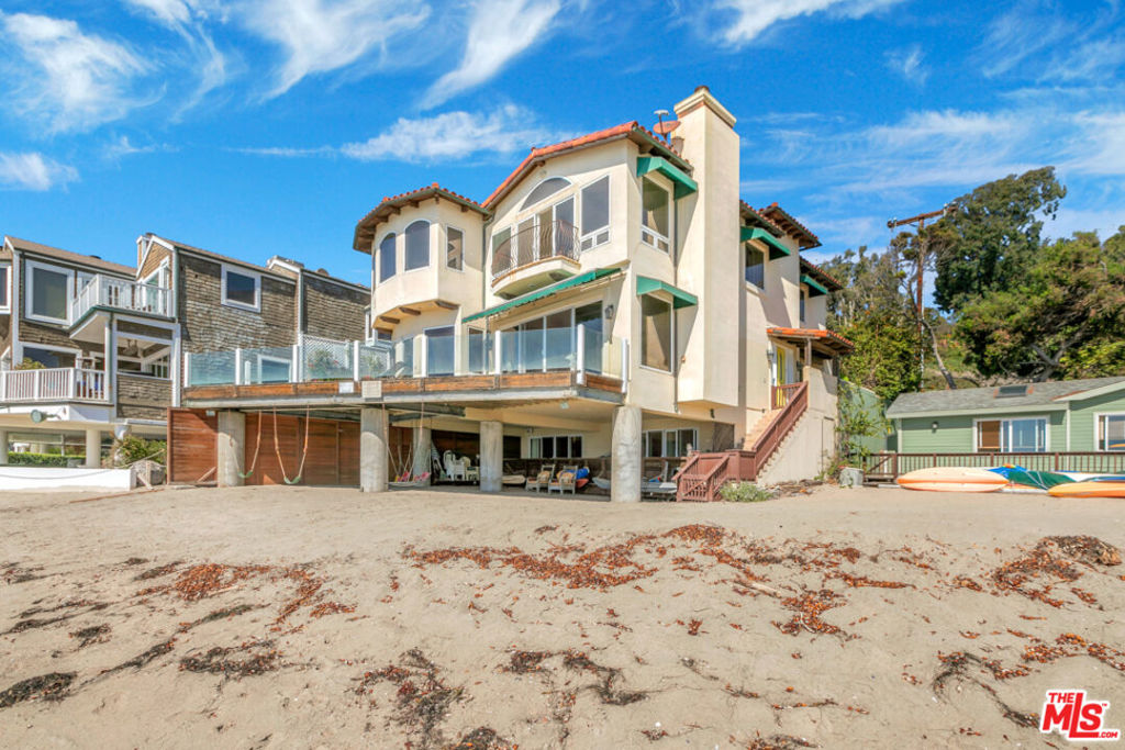 Incredible opportunity to live in one of the best locations in all of Malibu. This 3 story, 5 bedroom, 4 bath home sits on sandy Escondido Beach! Commanding coastline views from Palos Verdes to Point Dume. Large ocean front master and master bath that look directly to the bright blue ocean. Main floor combines high ceilings and open floor plan with living room, dining area and kitchen facing out to the beach. Large entertainers deck flows off living room and kitchen. Lower floor has guest bedroom, large office, full bath and laundry area. Sliders that open to second large shaded deck with direct access to the sand. Home is situated on private street and is completely gated with 2 car garage. Walk to Little Dume and Paradise Cove! ALL SHOWINGS TO BE MONDAY-FRIDAY BETWEEN11AM & 4PM (Buyer and buyers agent to confirm square footage and buyers responsibility to perform inspections.)