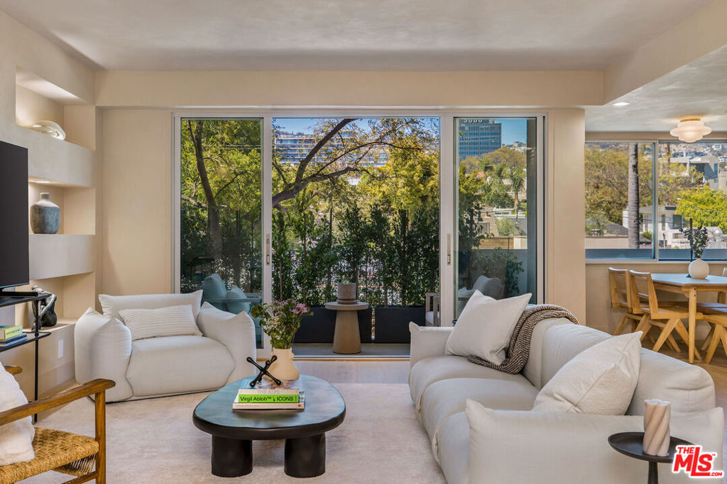 Full Service/24 Hour Secure Doheny Plaza with doorman, valet, resort style pool/gym and situated across from the Beverly Hills Flats on the prestigious Doheny Dr. HOA covers all utilities (AC/heat, water, and electricity) The property is fully furnished and just completed a 2024 warm, earthy remodel with the most luxurious materials. The double door entry leads to high ceilings, custom built-ins, natural light, and patio views of the Hollywood Hills through the sleek sliding glass doors. The oversized kitchen has a custom bar area that opens to the living room that is perfect for entertaining guests. The kitchen boasts all new Top-of-the-line Fisher Paykel appliances w custom coverings, an induction range, and with beautiful custom cabinets, and Taj Mahal Quartzite countertops with custom stone shelves. The custom bar has a built-in wine fridge and glass cabinet, adding a touch of indulgence to your daily life. Roman Clay throughout the living room and kitchen was done by a designer featured in Vogue. The bathrooms have travertine flooring/baseboards, European fixtures, faucets, integrated sinks, and Taj Mahal Quartzite, custom cabinetry. Kelly Wearstler's lighting throughout the home adds a unique touch. Additional updates include custom solid wood closets in bedrooms, wide oak floors, all new windows/doors, new air conditioning, and plumbing/electrical brought up to 2024 codes with permits. The building recently underwent a major million-dollar renovation. Welcome home to luxury living in the heart of West Hollywood close to Beverly Hills, Soho House, The Edition, and the best Restaurants and Nightlife this city offers.