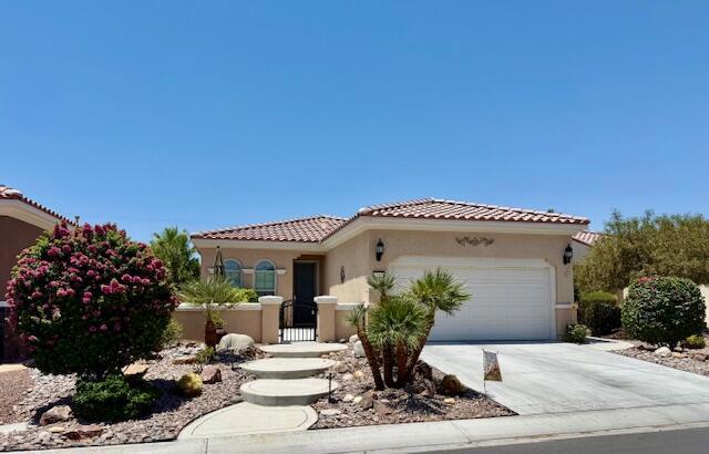 Welcome Home to this 1488 sq. ft. Serrente Plan where a custom front walk, steps and an enclosed gated front courtyard await. The rear covered patio with a water feature and firepit has endless views. Two bedrooms, two baths and an office or third bedroom along with ceramic tile flooring thru-out home. The open kitchen has - near new stainless- steel appliances, large slab granite island and counters, Reverse Osmosis drinking water and a touchless faucet. Both bathrooms have night lighted mirrors, A solar tube brings light into the laundry room with direct access to the garage. Epoxy floor and an extended garage comes with a water softener, tankless water heater, mini split air conditioner, storage cabinets, a window in the side door and a security door. The home has been recently painted inside and out and a new solar system has just been added. Low maintenance landscaping, rear yard views and upgraded plumbing make this a wonderful place to call home.