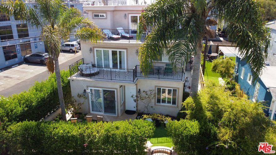Stunning 3-story canal-front home in the heart of Venice, offering modern luxury and unmatched location. Situated directly on the iconic Grand Canal, this spacious 4-bedroom, 4.5-bath residence features multiple balconies with serene water views, a private garden patio with canal access, and a private entrance through your own garage. The open and modern design includes an elevator for effortless access to all levels, with plenty of space for living, entertaining, and enjoying the coastal lifestyle. Just one block from the beach, Venice Pier, and the shops and dining along Washington Blvd, plus Erewhon a short walk away, this home perfectly combines the vibrancy of Venice and Marina del Rey with the tranquility of the canals.