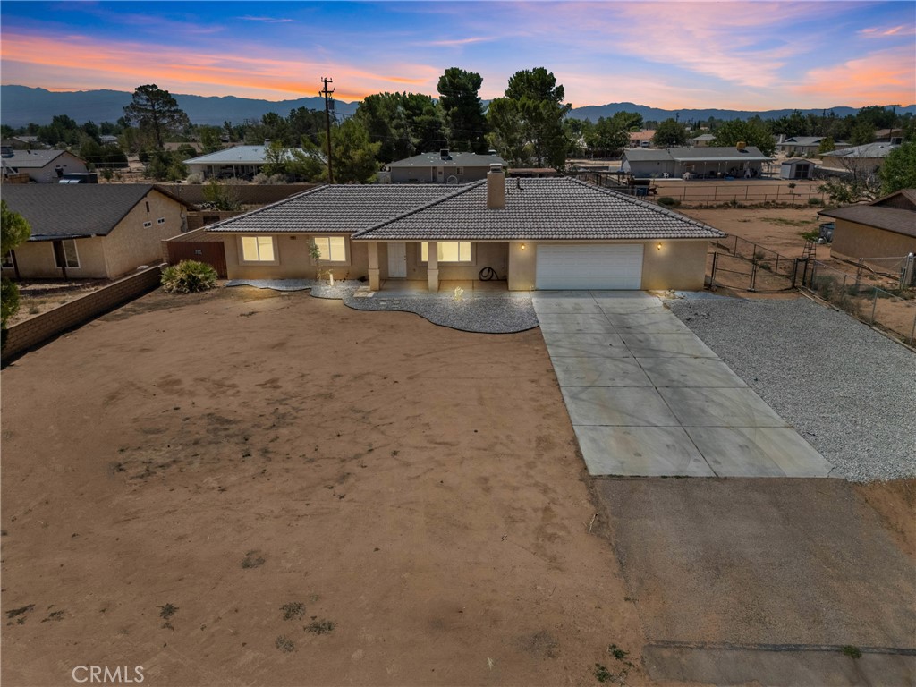 Listed at $398,000 — Fall in Love with This Beautifully Remodeled Single-Story Apple Valley Gem!
Welcome to 22225 Standing Rock Avenue, a stunning home built in 2006 offering 4 bedrooms, 2 bathrooms, and 1,777 sq ft of spacious, light-filled living on a sprawling (0.41 acre) 18,000 sq ft lot. This beautifully remodeled gem features an open kitchen floorplan—an ideal plan for a chef and perfect for entertaining.
Natural light floods throughout the home, highlighting the expansive living areas and a cozy fireplace. The primary bedroom boasts a spacious en-suite bathroom and generous closet.
Enjoy a fully fenced backyard with plenty of room for outdoor fun, gardening, or future enhancements, along with a large front yard and ample space for RV parking. The split bedroom layout and oversized two-car garage add to the convenience and functionality.
Located in a quiet neighborhood close to schools and commuter routes, this move-in ready home is priced to sell and waiting for you to make it yours!