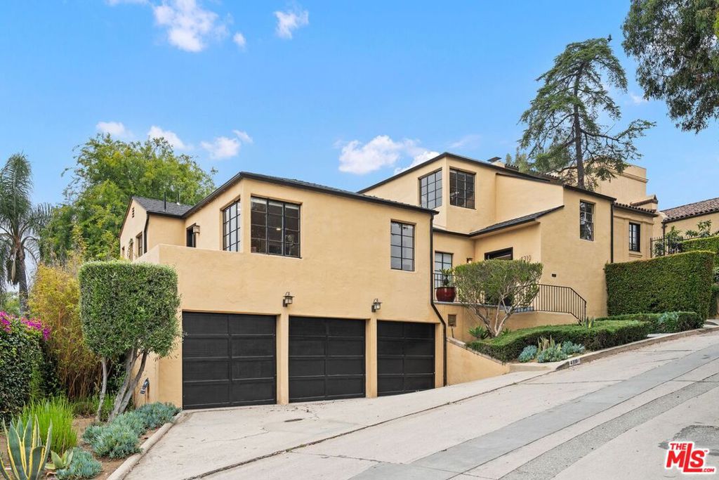 Tucked away on a picturesque cul-de-sac in the prestigious Los Feliz Oaks, 4310 Cedarhurst Circle is a rare gem, a sophisticated 1937 traditional home brimming with timeless character and modern comfort. Surrounded by mature trees and set behind privacy hedges, this 4-bedroom, 3.5-bath residence offers approx. 2,644 sq ft of thoughtfully designed living space on an approximately 6,100 sq ft lot.A classic center-hall layout welcomes you with graceful scale and flow. Sunlight pours through original steel casement windows, illuminating the formal living room with fireplace, an elegant dining room ideal for entertaining, and a richly detailed den or library retreat. The gourmet kitchen features custom cabinetry, a center island, skylight, and built-in Thermador range, seamlessly connecting to a charming breakfast area and outdoor terrace perfect for al fresco dining.The upstairs is home to generously sized bedrooms, including a serene primary suite with treetop views and a beautifully appointed en-suite bath. Downstairs, a versatile bonus room offers potential as a home office, media lounge, or guest quarters. Additional highlights include a lower-level laundry room, direct-access 3-car garage, and updated systems throughout.Located in a coveted enclave moments from Griffith Park hiking trails, Franklin Avenue Elementary, and the best of Los Feliz Village. This is a special opportunity to own a truly graceful and private residence in one of Los Angeles' most sought-after neighborhoods.