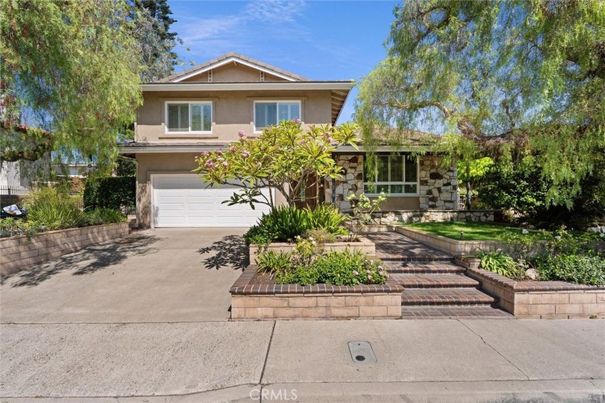 Gorgeous Views! Beautiful 4-bedroom,3-bath,2515 sq.ft. home located high on the hill in the exclusive guard gated community of Bixby Hill. Set on a 10,428 sq ft. lot with amazing views, this residence offers new paint throughout, granite counters, a Dacor 6-burner stove with grill, Miele dishwasher, Listone Giordano hardwood floors in family room, Milgard windows, tile roofing, a finished 2 car garage, and an updated electrical panel. Designed with comfort in mind the home features huge skylights in kitchen and upper bath, 4 sun tunnels, and ceiling fans in every room. Additional highlights include 2 wood burning fireplaces, an old school laundry chute, and thoughtfully updated kitchen and baths. The expansive backyard is perfect for entertaining with Trek upper and lower decks, a huge saltwater spa, garden fountain, garden seating areas, and mature fruit trees (pomegranate, persimmon, blood orange, avocado) Conveniently close to CSULB, beaches, shopping, bike paths, golf courses, and major freeways.