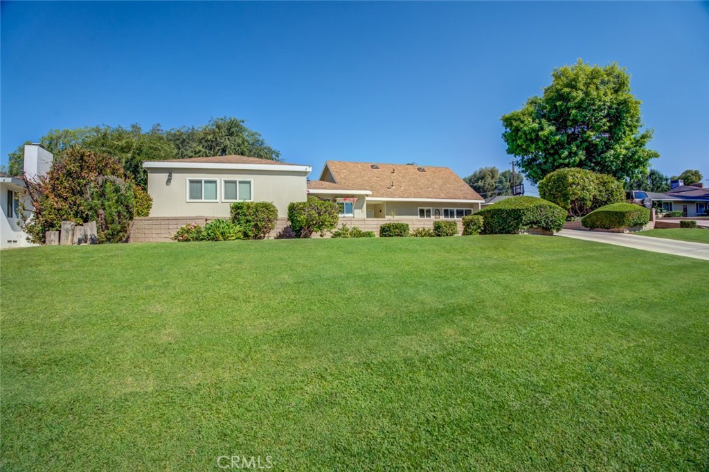 Spacious East Bakersfield Home with Pool & Bonus Rooms. Discover this expansive 5-bedroom plan, 3-bathroom home, complete with a sparkling pool, in desirable East Bakersfield. Step inside to find a large formal living room with an adjoining formal dining area, plus an additional living room for relaxed gatherings. The generous kitchen features a center island, abundant cabinet space, and a breakfast area. Two bonus rooms offer endless possibilities one currently set up as a gym, the other as a quiet sitting area or extra storage. The 5th bedroom serves as a dedicated office with built-in cabinetry. The spacious primary suite includes a private sitting area, backyard access, and an updated bathroom with dual sinks, a separate tub, and a shower. Outdoors, enjoy two covered patios, mature landscaping, and a pool complete with an outdoor shower, half bath, and changing room perfect for entertaining.