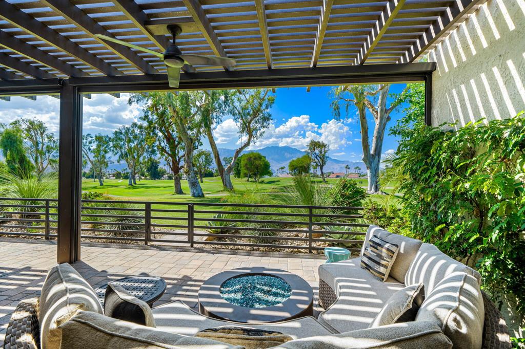 Stylish Contemporary Renovation with Stunning Finishes, Mountain Views across Multiple Fairways of the Tournament Course at Mission Hills Country Club, and a Large Private Courtyard Oasis. Enter the property through a stunning gate to the zen courtyard with custom pavers. Double Glass Doors lead to a dramatic open Great Room with beamed ceilings, fireplace, entertainer's bar with wine refrigeration and walls of glass overlooking stunning mountain views. Gourmet Chef's Kitchen with quartz countertops and island, stainless appliances and white cabinetry opens to the dining area with views of the golf course and mountains and access to the back patio. Primary Suite with Terrace access. a spectacular updated Spa Bath with a large walk-in shower and walk-in closet. Two guest suites each with its own updated bath provide room for family and friends or a den/media room. Back Terrace has covered outdoor living with pavers and exceptional views of the golf course and mountains. Come home to your of the moment contemporary desert oasis in coveted Mission Hills Country Club.
