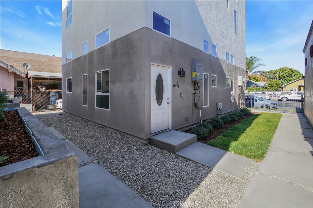 MOVE IN READY TODAY: NEWLY BUILT TOWNHOME STYLE UNIT boasting 4 large bedrooms and 4.5 bathrooms, ideally located near driving distance to USC, Downtown LA and Inglewood. Priced starting at $3,950- this unit offers modern living at its finest. This unit has a 1-car garage and in-unit private laundry facilities with a stove, refrigerator, microwave and dishwasher. Ascend to the expansive, luminous open concept living area & combined kitchen & dining area. Enjoy privacy and tranquility in your new home. Retreat to the master bedroom featuring a luxurious en-suite bath and ample closet space. Bedrooms offer generous dimensions and expansive closets. Embrace the essence of community living & make this your home today! 4921 1/2 Normandie Ave St is part of a 4 Unit resident community located in Los Angeles County, within the 90037-zip code. Call today and book your private tour. This unit is perfect for a multi-generational extended family.