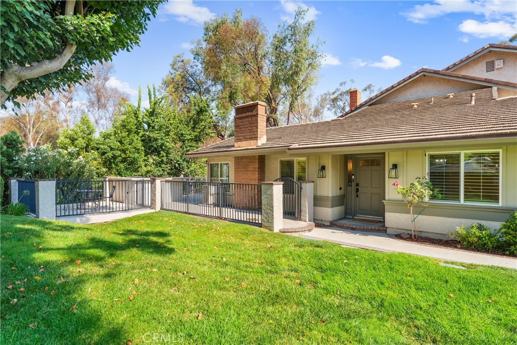 Welcome to this beautifully upgraded single-story home featuring 3 spacious bedrooms and 2 modern bathrooms. Nestled in the trees above the Anaheim Hills Golf Course, this end unit enjoys a front grassy yard and a great outdoor area including a deck and a built in BBQ for those great summer evenings and family gatherings. There is also a bright and airy open floor plan that is perfect for entertaining, with stylish finishes throughout. Enjoy cooking in the gourmet kitchen, with a new and updated look including quartz countertops and teal glass tile backsplash. The primary bed and bath are both nicely sized with 2 great closets and an enormous walk in beautifully designed shower. The 2 additional bedrooms are both large and the hall bathroom is perfectly updated. Additional features include a two-car attached garage providing ample storage space. This Anaheim Hills location is close to great schools, shopping and restaurants. Do not miss this opportunity to own this charming home which combines comfort and style—perfect for your next chapter!