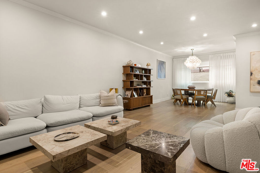 This tastefully updated 2-bedroom, 2-bathroom condo in prime West Hollywood offers the ideal blend of luxury, comfort, and location. The spacious layout features a modern chef's kitchen, beautifully updated bathrooms, newly installed windows and stylish finishes throughout. Expansive living and dining areas offer the perfect setting for both relaxing and entertaining, while two generously sized bedrooms include a serene primary suite with a huge walk-in closet plus additional closets for extra storage, and a spa inspired bath. Additional highlights include: 2 side-by-side parking spaces, secure gated entry, and access to resort-style amenities such as a pool, sauna, and recreation room. Situated in the heart of the Norma Triangle, one of LA's most walkable and sought-after neighborhoods. This turnkey residence is moments from world-class shopping, dining, nightlife, and everything West Hollywood and Beverly Hills have to offer.