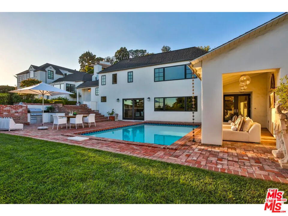 This stunning furnished property is a Hollywood gem with panoramic views stretching from downtown LA to the Pacific Ocean. Nestled in the historic Hollywood Hills, the beautifully renovated home, designed by architect Gus Duffy, blends the charm of the 1920s with modern luxuries. Featured on Netflix's Selling Sunset and Domino magazine, this three-bedroom, five-bathroom sanctuary offers a light-filled living room, a chef's kitchen, and a cozy den with a 70-inch TV and high-end surround sound. Outside, you'll find an entertainer's paradise: a heated pool, brand new pergola with an outdoor BBQ, heat lamps, loungers, and a spacious dining area perfect for al-fresco meals or poolside relaxation. The primary suite is a retreat unto itself, featuring a private office, walk-in closet, sunken tub, shower, and a balcony with serene views. This home offers exceptional privacy, yet is just moments away from the lively Sunset Strip. With a design that marries historic details and modern amenities, and an unbeatable location near top dining, shopping, and nightlife, this property is a must-see! Don't miss your chance to lease this architectural beauty! Parking for 4-6 cars is available in the carport and driveway. Gardener included. Utilities (electricity, internet, gas) are the tenant's responsibility.