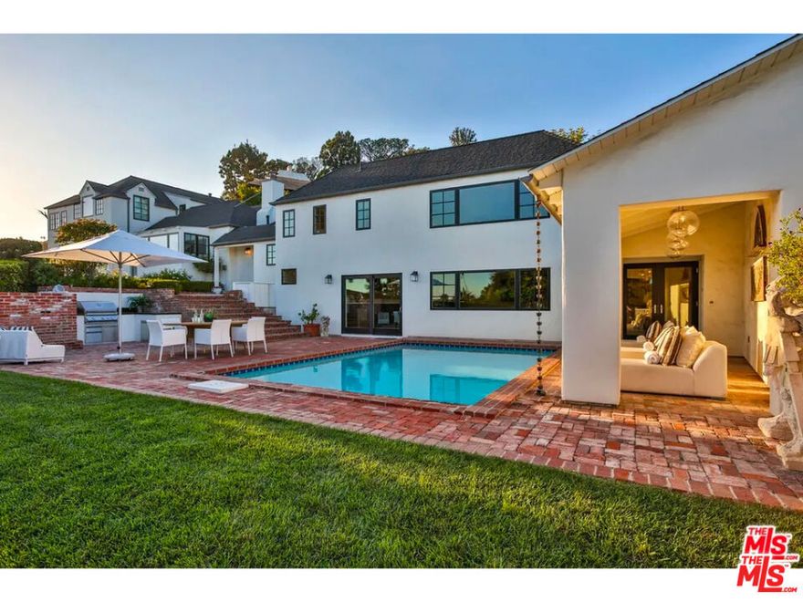 This stunning furnished property is a Hollywood gem with panoramic views stretching from downtown LA to the Pacific Ocean. Nestled in the historic Hollywood Hills, the beautifully renovated home, designed by architect Gus Duffy, blends the charm of the 1920s with modern luxuries. Featured on Netflix's Selling Sunset and Domino magazine, this three-bedroom, five-bathroom sanctuary offers a light-filled living room, a chef's kitchen, and a cozy den with a 70-inch TV and high-end surround sound. Outside, you'll find an entertainer's paradise: a heated pool, brand new pergola with an outdoor BBQ, heat lamps, loungers, and a spacious dining area perfect for al-fresco meals or poolside relaxation. The primary suite is a retreat unto itself, featuring a private office, walk-in closet, sunken tub, shower, and a balcony with serene views. This home offers exceptional privacy, yet is just moments away from the lively Sunset Strip. With a design that marries historic details and modern amenities, and an unbeatable location near top dining, shopping, and nightlife, this property is a must-see! Don't miss your chance to lease this architectural beauty! Parking for 4-6 cars is available in the carport and driveway. Gardener included. Utilities (electricity, internet, gas) are the tenant's responsibility.