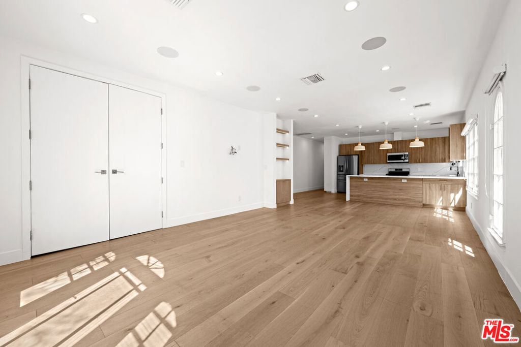 Stunning Remodeled 2-Bedroom, 2-Bathroom with Parking Garage Steps from The Grove! This beautifully renovated residence features a spacious open floor plan with sleek modern finishes, offering the perfect blend of comfort and style. Highlights include built-in surround sound, chic new blinds, and secure electric locks for effortless living. Both bedrooms are generously sized with full bathrooms, ideal for comfortable living or sharing. Natural light pours in, accentuating the contemporary design and inviting atmosphere. With a private parking garage and a location just moments from The Grove, Beverly Hills, and premier dining, shopping, and entertainment, this is Los Angeles living at its best.
