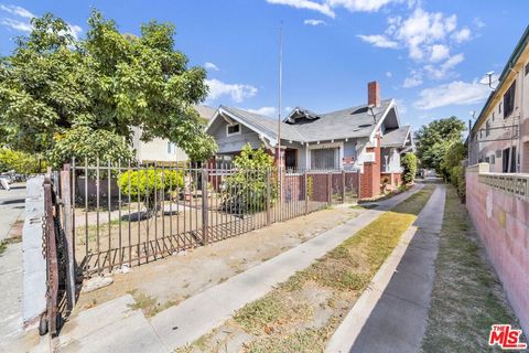 Photo of 1215 W 39th Place, Los Angeles, CA 90037 (MLS # 25581935)