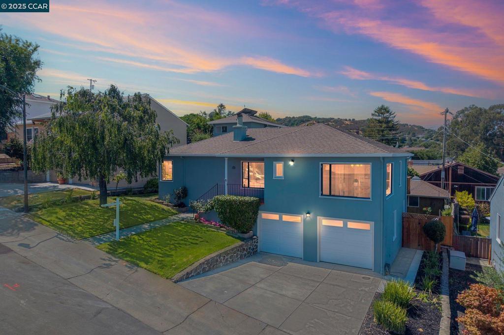 Nestled in the tranquil hills of San Mateo, this expanded 4-bedroom, 2.5-bath home offers approximately 1860 plus sq. ft. of flexible living space with sweeping views of the San Francisco Bay. Refinished hardwood floors, a new electric fireplace, updated electrical, a ventless hood and cooktop, fresh paint, and new decking blend timeless charm with modern upgrades. The oversized garage—with parking for two cars, including a tandem space—features new concrete flooring, updated piping, and a complete sewer lateral replacement, offering ample room for vehicles, storage, or a workshop. Outdoors, enjoy newly landscaped grounds with Orange and Lemon trees, an expansive view deck, inviting patios, and a covered gazebo designed for gatherings and family traditions. An addition completed in the late 1960s created the fourth bedroom. The additional sq. ft. of living space added is unknown and was never reflected on the tax roll. A rare opportunity to enjoy comfort, versatility, and views in a peaceful neighborhood just minutes from Peninsula conveniences.