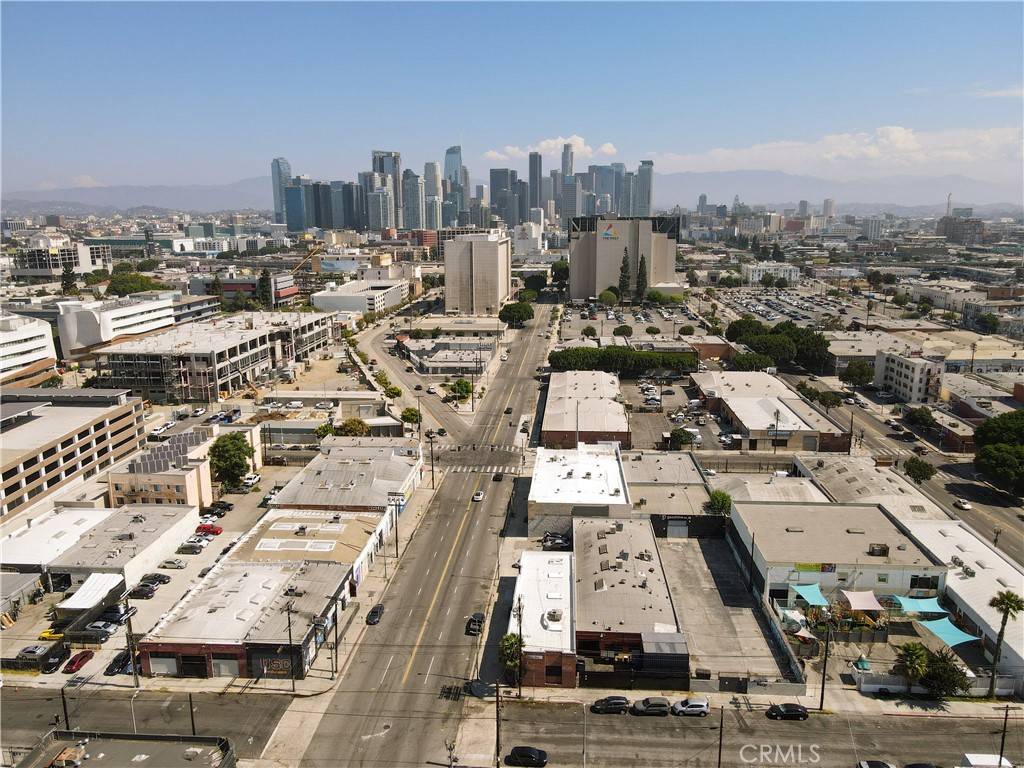 Probate listing, may be subject to court confirmation. This is a unique opportunity to acquire two contiguous commercial properties located at 2300 S Hill St (built in 1987) and 2320 S Hill St (built in 1939). Together, the properties offer 11,154 SF of building area on a combined 13,673 SF lot, with both buildings being single-story and supported by a total of 15 parking spaces (12 of which are tandem parking spaces).
2320 S Hill St (3,054 SF) is currently tenant-occupied, providing immediate income to the owner. 2300 S Hill St (8,748 SF) is ideally suited for an owner-user, featuring versatile warehouse space, two large private offices, an open-floor workspace, an additional multi-desk office area, a kitchen, and a large storage room.
Situated in the heart of Los Angeles’ vibrant commercial corridor, the properties are just minutes from Downtown LA, the Fashion District, and the 10 & 110 Freeways, offering excellent connectivity throughout the region. The central location makes these parcels highly desirable for both investors and owner-users seeking long-term value and accessibility.