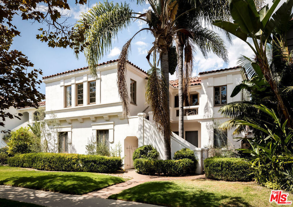Step into the charm of this rare 1930s Spanish Art Deco duplex, perfectly positioned just south of Beverly Hills and west of Hancock Park. Behind a charming gated courtyard awaits a rare opportunity to own two expansive and stylishly reimagined 3-bedroom, 2-bath residences, each brimming with character and natural light from oversized French windows. The upper unit will be delivered VACANT; move-in ready and available furnished, if desired, making it an ideal choice for an owner-user or immediate rental. The lower unit is currently leased at $6,395/month, offering steady income. Nearly identical in layout, both homes showcase timeless period details including coved ceilings, graceful archways, hardwood floors, original built-ins, and oversized living and formal dining rooms. Each also includes a spacious breakfast room perfect for casual dining or a dedicated workspace, while the lower unit features an additional flexible bonus room, ideal as an office, guest suite, or creative studio. Thoughtfully remodeled, both residences feature updated kitchens and baths, all-new plumbing and electrical, and a brand-new roof, delivering vintage charm with modern peace of mind. The 6,372 sq. ft. lot also includes a detached 4-car garage with EV hookup, plus a generous outdoor space with lush landscaping. The beautifully redone backyard is perfect for entertaining, hosting, or relaxing in a private, tranquil setting. Situated in the heart of the coveted South Carthay HPOZ, this property offers the perfect blend of timeless style, investment potential, and prime location just moments from Beverly Hills shopping, dining, and parks.