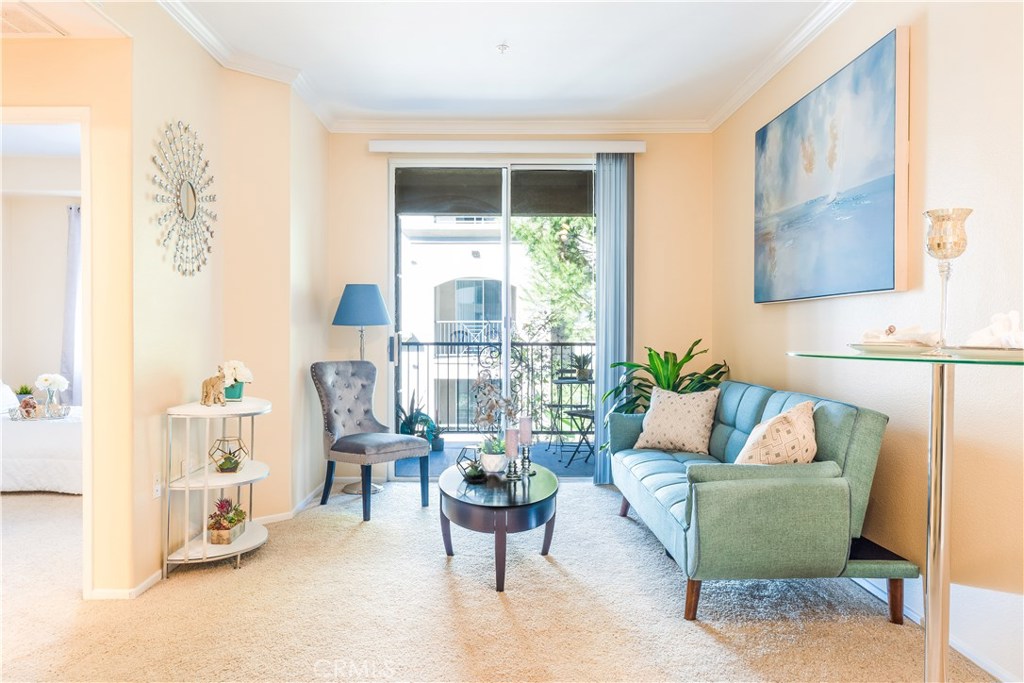 Beautiful Astor Court model located on the 3rd floor with the tree lined walkway view! This one bedroom one bathroom home includes Nest technology, granite counter tops, stainless steel appliances in the kitchen and crown molding. Enjoy soothing breeze from the private patio! The sophisticated living of the Watermarke community offers bounty of amenities including concierge services, business and fitness centers, movie theater and billiards rooms, 3 pools, 4 spas, and an indoor basketball and tennis courts. Gated parking structure. Refrigerator and stackable washer and dryer in kitchen are included in the sale. Come see this cozy condo and make Watermarke your home!