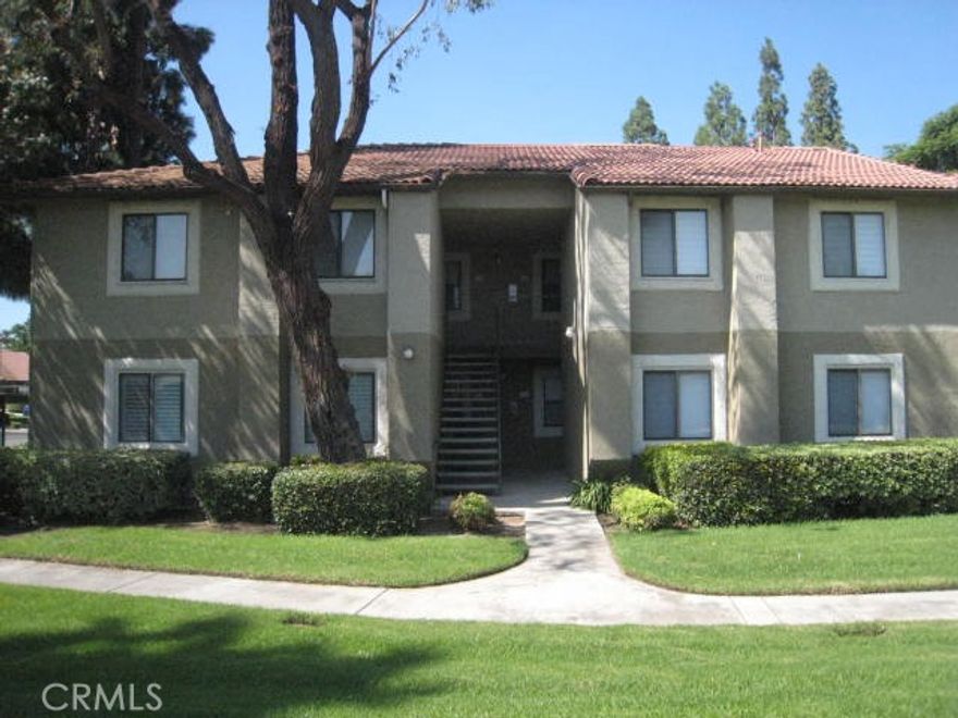 Beautiful well maintained gated La Serena Community with pool & spa, sauna, club house!  Newer flooring and paint throughout.  Bright and airy downstairs unit with 2 spacious bedrooms overlooking green lawn (no building on the opposite side), an updated bathroom.  A spacious living/family room, breakfast nook next to patio sliding glass door, and the kitchen is updated as well! Large patio for BBQ & afternoon sunset.  Two parking spaces are next to each other, located  next to the Unit building, and one is covered.  Conveniently located ~ shopping, dining, schools and freeways.
