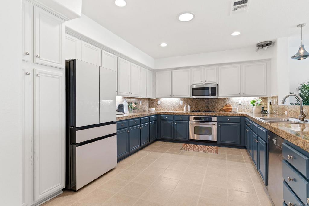 You will be in awe of the panoramic views of the Omni La Costa Golf Course from this beautifully updated 3-bedroom, 2.5-bathroom townhome with 2,523 sq. feet of sun-filled living space. Perched above the 16th fairway of the Legends Course, this spacious home has just been freshly painted and features brand-new carpet throughout. The open layout lives like a single story, with all bedroom and main living areas conveniently located on the upper level. Soaring 9’ ceilings and solar tubes invite an abundance of natural light into the living spaces. The generous living room offers a cozy fireplace, built-in surround sound, and direct access to a private view deck–perfect for relaxing or entertaining with golf course views. The large kitchen is designed for both function and style, with granite countertops, stainless steel appliances, and ample cabinet space. The primary suite boasts breathtaking fairway views, a private balcony and a luxurious en-suite bathroom. Additional highlights include a full-size laundry room, a tankless water heater and a 2-car attached garage. Located in an exclusive 8-home enclave with low HOA fees ($375), this property is perfect as a full-time residence or a luxurious vacation retreat. Washer, dryer and refrigerator are included.